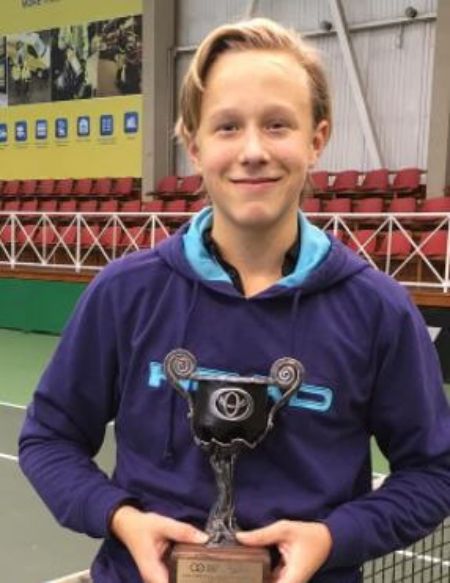 He is wearing a blue hoody.